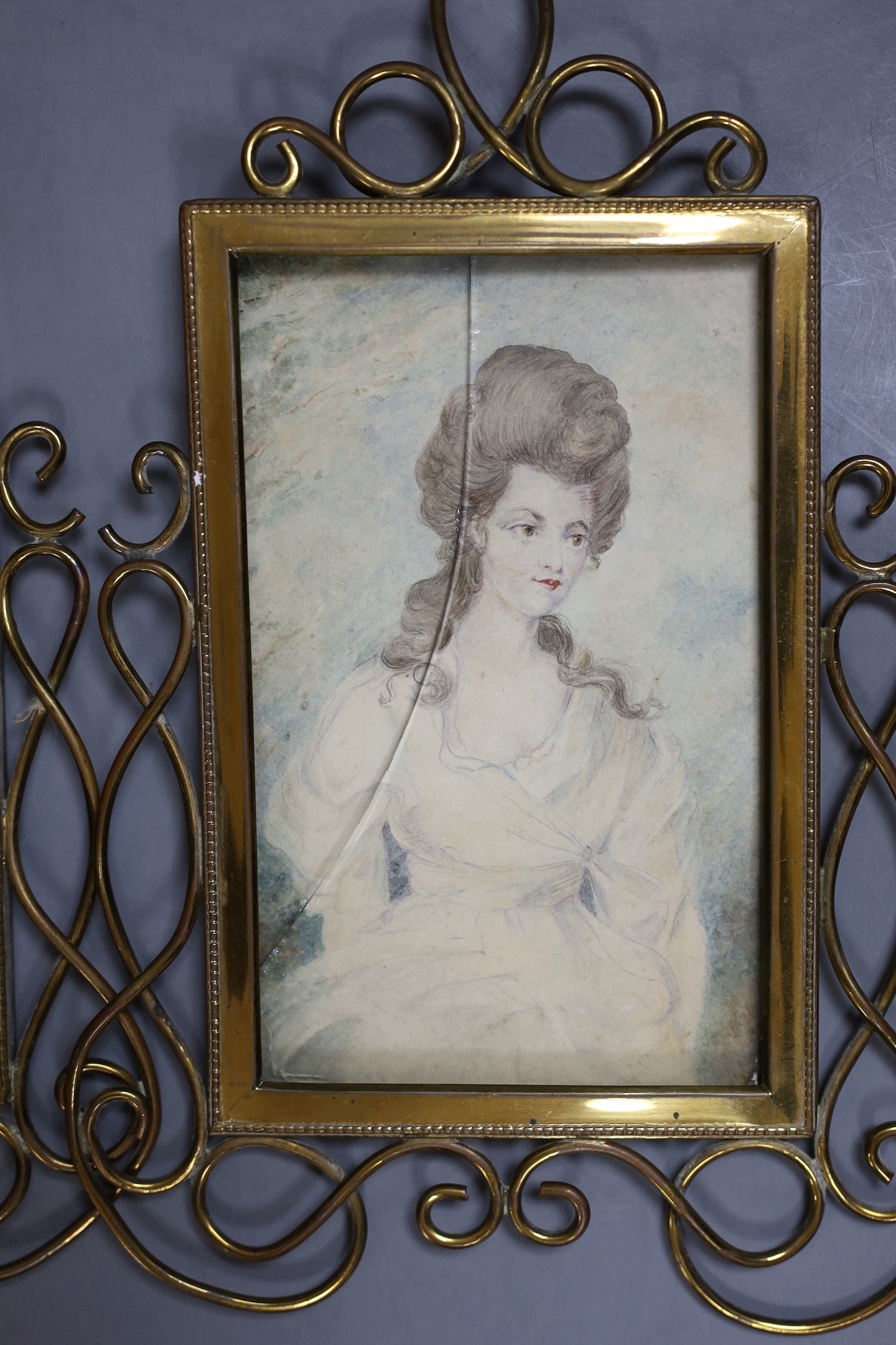 English School c.1900, pair of watercolour, Portraits of ladies, 15 x 9.5cm, housed in brass scroll frames